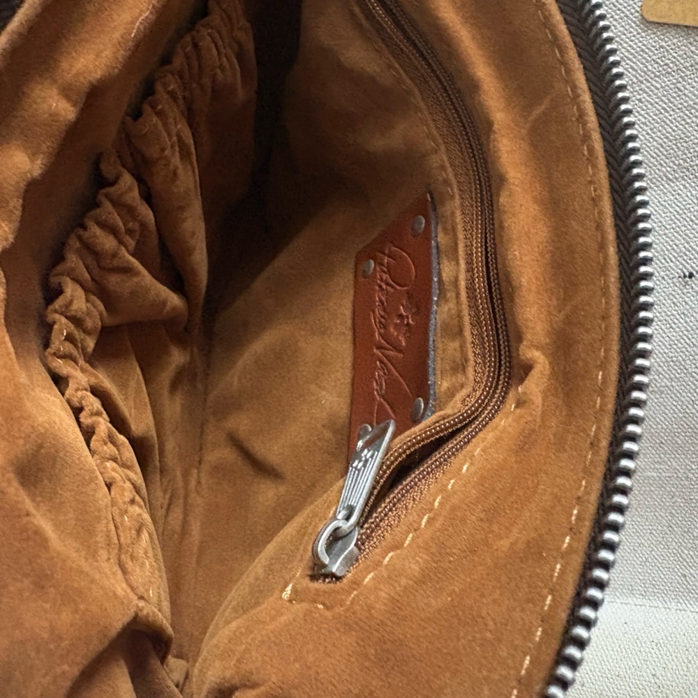 Patricia Nash Cassini Wristlet
Tooled Turquoise - Picture 7 of 8